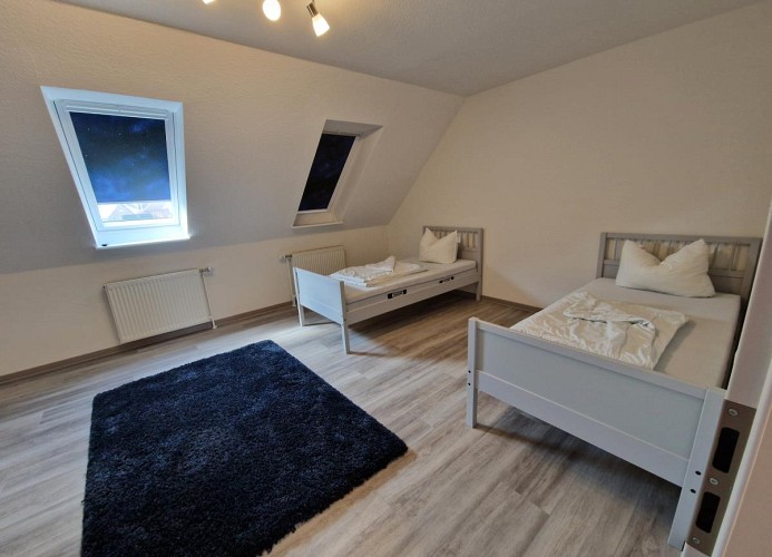 Ein Schlafzimmmer im OG mit 2 Einzelbetten